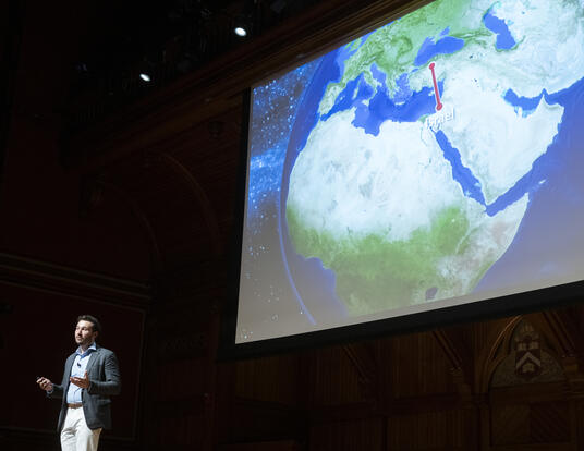 Andrew O'Donohue speaking onstage