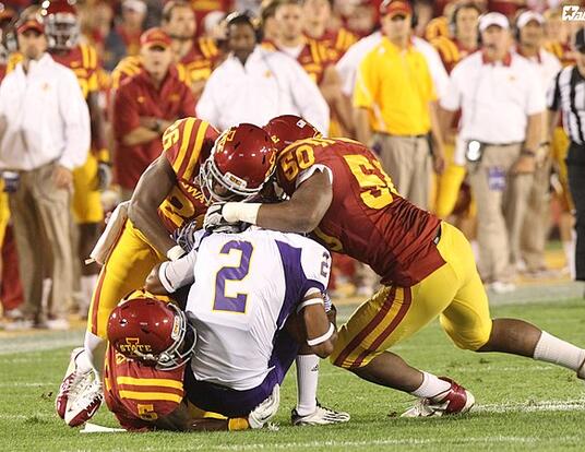 Gang tackle at an Iowa State football game