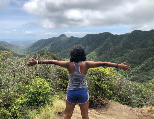 Swathi Srinivasan overlooks mountains in Hawaii