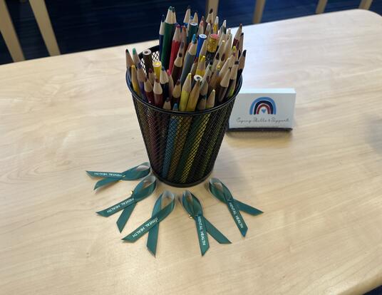 Green mental health awareness month ribbons at the CAMHS front desk