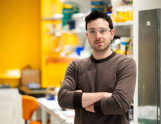 PhD student Raphael Kay in the lab