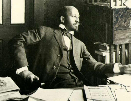 W. E. B. Du Bois, seated at his desk, Atlanta, Georgia, 1909