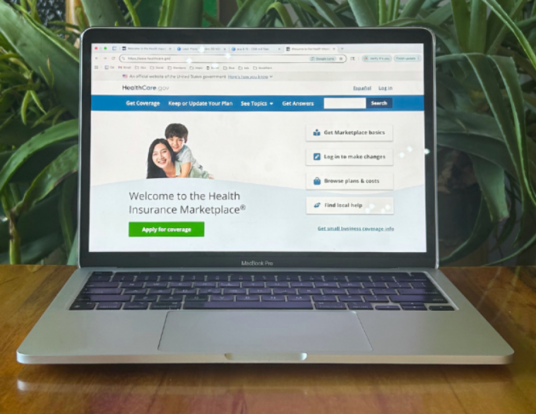 Laptop computer with health insurance enrollment screen