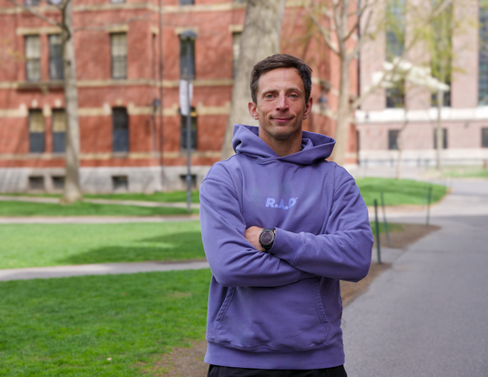 Pawel Pieniazek in a purple sweatshirt that reads, "R.A.D."