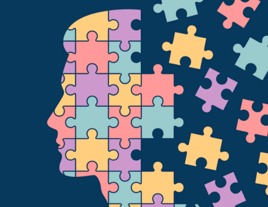 Illustration of a person's head in profile, dissolving into a jigsaw puzzle.