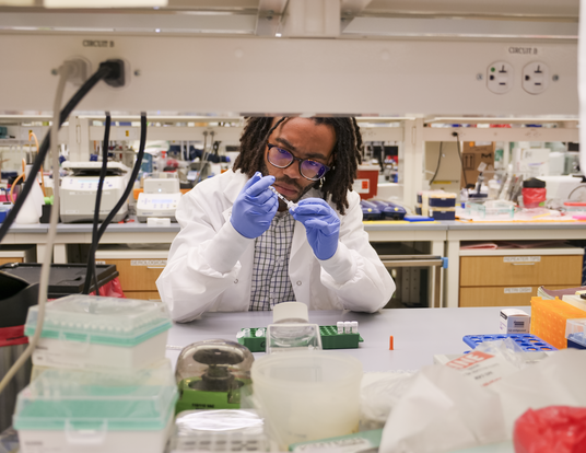 Alton Gayton inside lab wearing lab gear