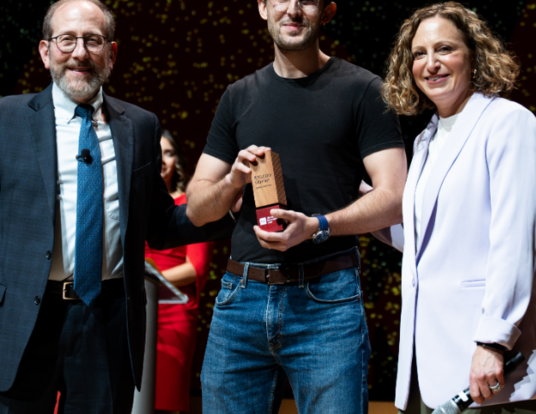 Master's student Yann Calvó López accepts the President's Innovation Fund grand prize