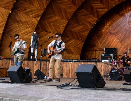 Members of the graduate student-led band Luigi's Fishtank perform at "Abilities: Amplified" on Boston's Esplanade.