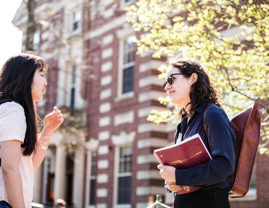 Students speaking to each other in Harvard Yard