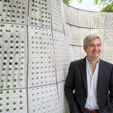 Stephen Ansolabehere standing in front of cement wall