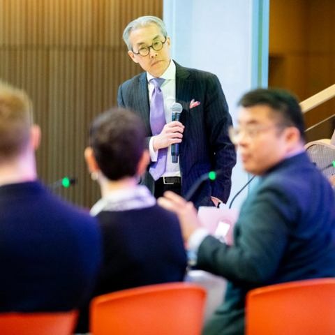 Harvard Business School’s Nien-hê Hsieh (standing) posed a hypothetical to the panel.