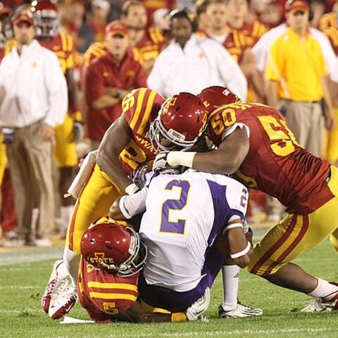 Gang tackle at an Iowa State football game