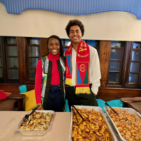 Atte (left) and Isaias (right) organized, “A Taste of Africa,” a food and music sampling event for Perkins residents. Featured dishes, from left to right, are Congolese poulet mayo, sweet fried plantains, and Congolese beignets.