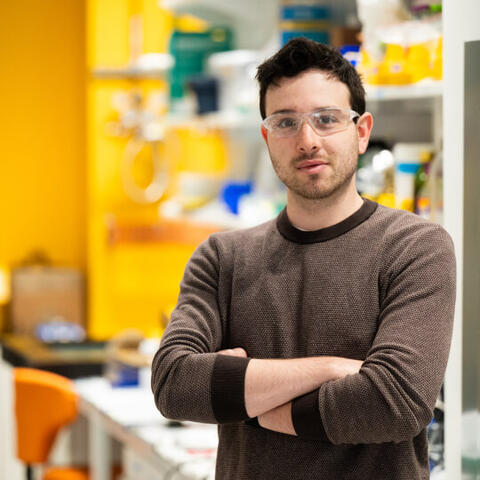 PhD student Raphael Kay in the lab