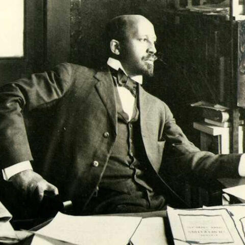 W. E. B. Du Bois, seated at his desk, Atlanta, Georgia, 1909