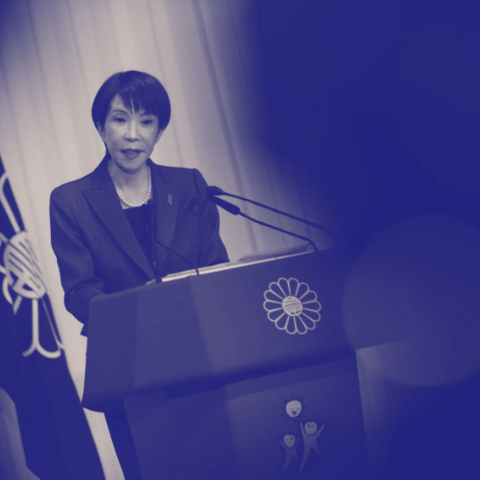 Black and white photo of Sanae Takaich, Japan’s Prime Minister, at a podium