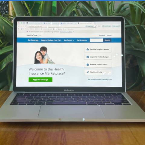 Laptop computer with health insurance enrollment screen