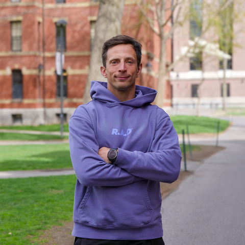 Pawel Pieniazek in a purple sweatshirt that reads, "R.A.D."