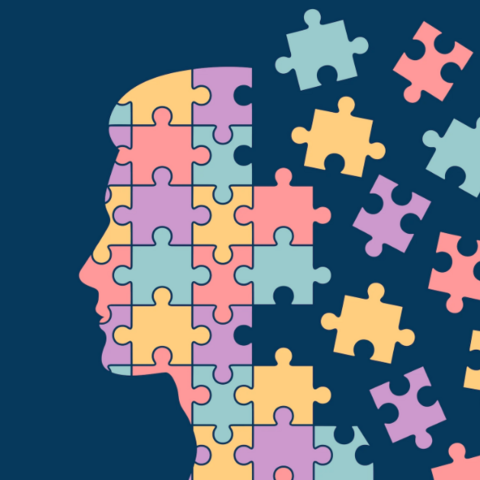 Illustration of a person's head in profile, dissolving into a jigsaw puzzle.