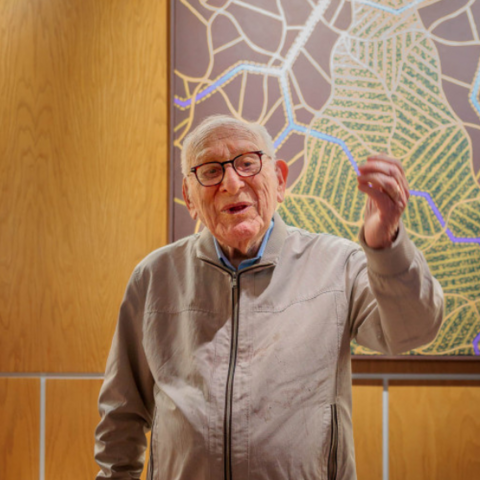 David Bakalar ’47, M.S. ‘48, stood before one of his “Brain Series” paintings, newly installed at Zimmer Hall.