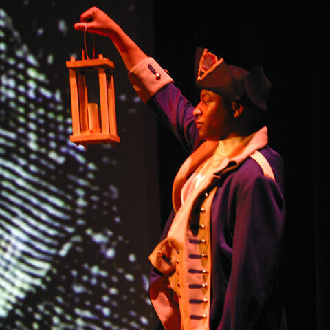 A Soldier dressed in a Revolutionary War period uniform holds a lantern during the Opening Ceremony for the US Army (USA) 31st Signal Symposium Event, at Fort Gordon, Georgia (GA).
