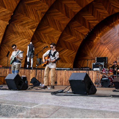 Members of the graduate student-led band Luigi's Fishtank perform at "Abilities: Amplified" on Boston's Esplanade.