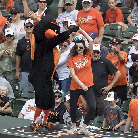 Baltimore Orioles mascot leads fans in a dance