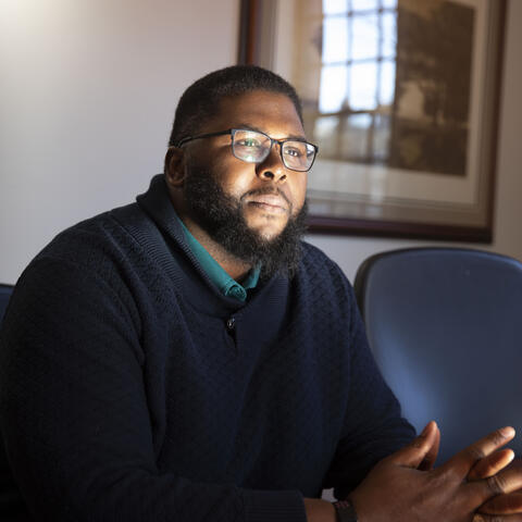Anthony Abraham Jack leans forward in his chair
