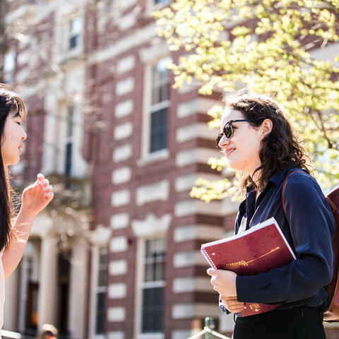 Students speaking to each other in Harvard Yard