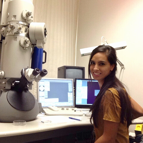 Kellie Jurado with Microsope in Lab