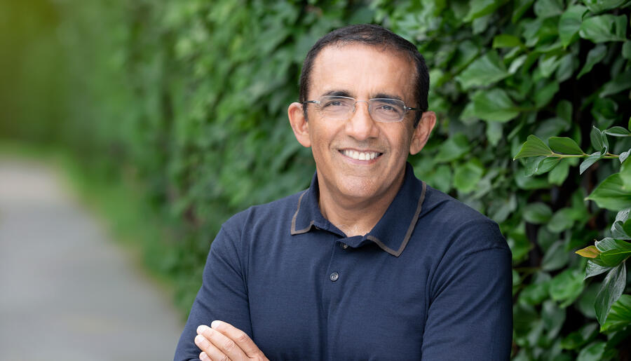 Ranjay Gulati in blue shirt with greenery background