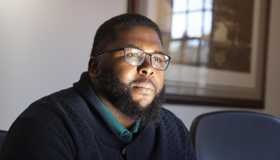 Anthony Abraham Jack leans forward in his chair