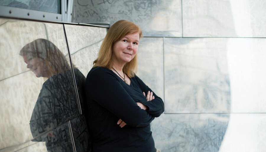 Janet Conrad posed with her arms crossed