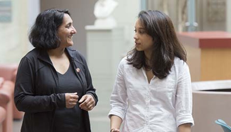 Sheila Thomas and Rosaria Fernandez walking at Harvard Medical School