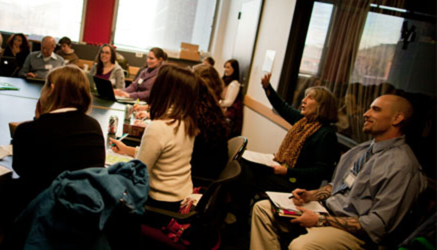 Students at table during conference.