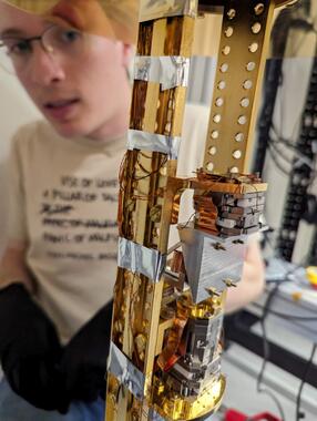 Stas checks dilution refrigerator optical fiber routing