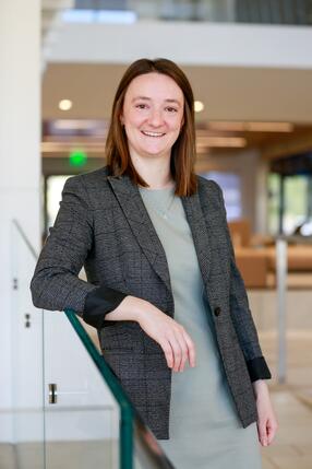 Hanne Collins standing against railing
