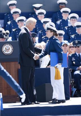 Yadlin shakes hands with then-Vice President Biden at her Air Force Academy graduation