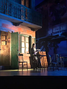 A photo of Levy reading during a lighting tech session of Seattle Opera’s 2019 production of Carmen