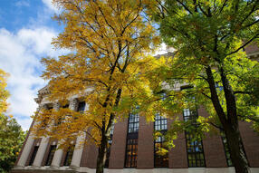 fall foliage in front of Harvard building