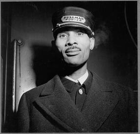 Black and white photo of a Pullman Porter at Union Station in Chicago, IL