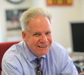 Headshot of Robert Allison smiling at camera