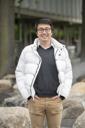 Portrait of Josh Wang; white coat with beige pants