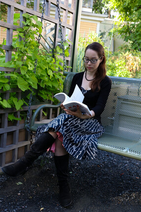Woman reading book outside