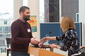 Andrew Yegian shakes hands with Dean Emma Dench