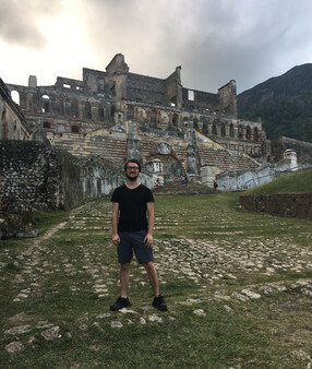 During a research trip, Stoll visited the ruins of the Palace of Sans Souci in Milot, Haiti. 