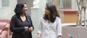 Sheila Thomas and Rosaria Fernandez walking at Harvard Medical School