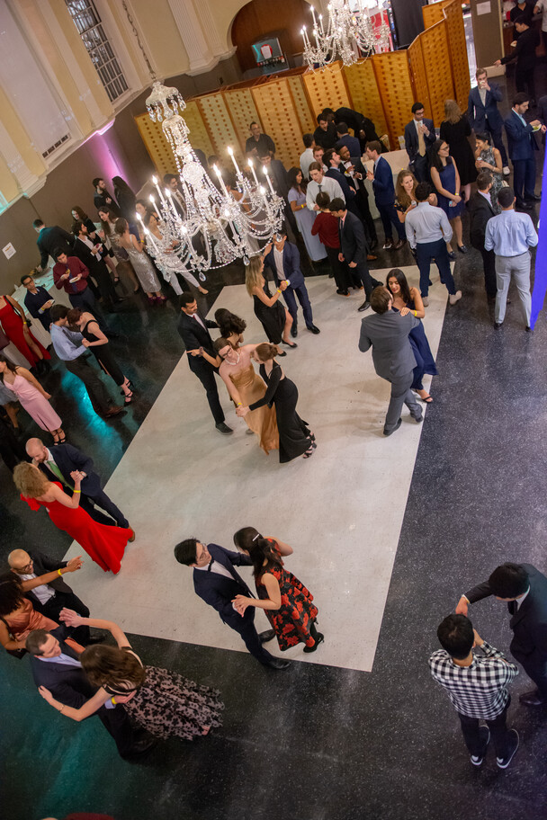 Students twirl under the Lehman Hall’s glimmering chandelier at the Winter Ball last December. 