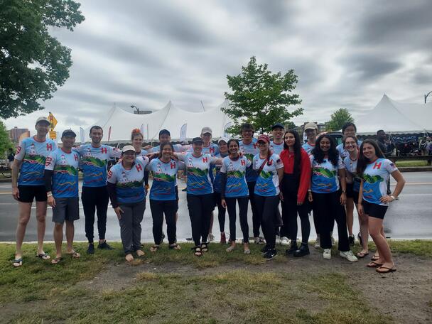 Aric Lu with the Harvard Griffin GSAS Dragon Boat Team