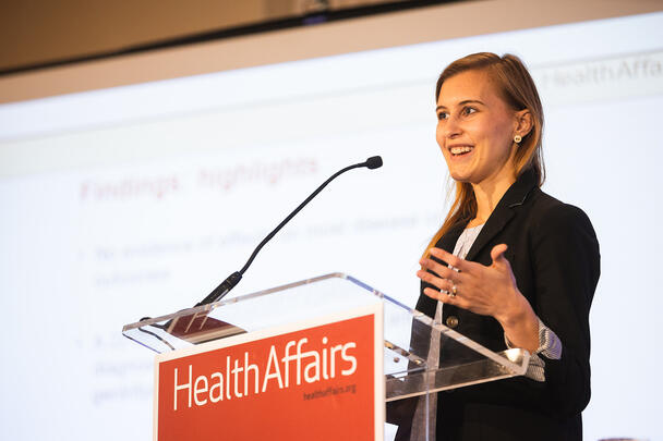 Kacie Dragan presenting research on housing and health at an event for policymakers and researchers in Washington D.C. 